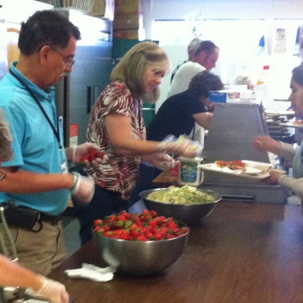 Serving meals to homeless at Bread of Life.